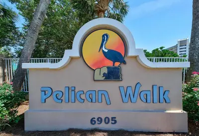a sign for a pelican walk sign at Pelican Walk 504 in Panama City Beach