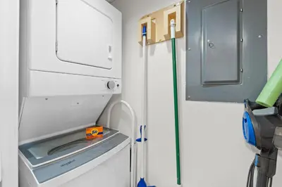 a kitchen with a sink and a hose at Pelican Walk 210 in Panama City Beach