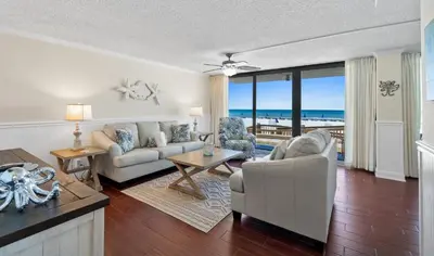a living room with a couch and a table at Pelican Walk 106 in Panama City Beach