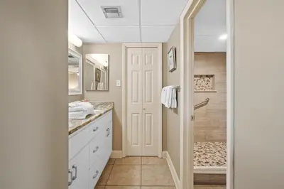 a bathroom with a sink and a shower at Pelican Walk 112 in Panama City Beach