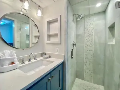 a bathroom with a sink and a shower at Pelican Walk 604 in Panama City Beach