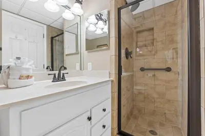 a bathroom with a sink and a shower at Pelican Walk 402 in Panama City Beach
