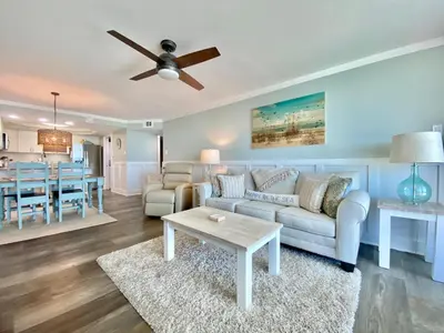 a living room with a couch and a table at Pelican Walk 611 in Panama City Beach