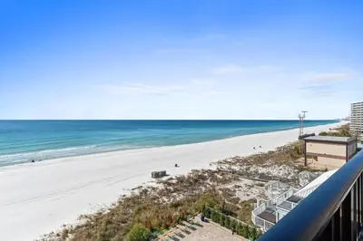 a view of the beach from the balcony of a condo at Pelican Walk 609 in Panama City Beach
