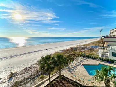 an aerial view of a beach with palm trees at Pelican Walk 408 in Panama City Beach