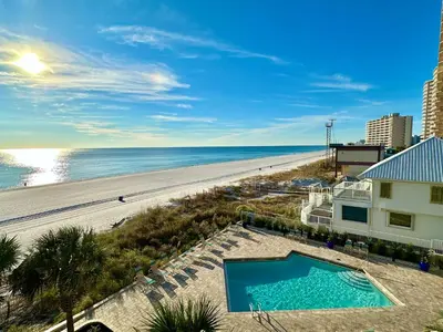 a view of the beach from the balcony of a condo at Pelican Walk 408 in Panama City Beach