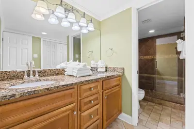 a bathroom with a sink and a shower at Pelican Walk 1005 in Panama City Beach