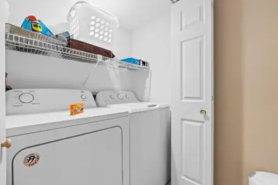 a laundry room with a washer and dryer at Pelican Walk 1005 in Panama City Beach
