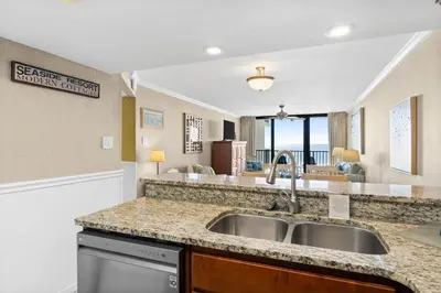 a kitchen with a sink and a counter top at Pelican Walk 410 in Panama City Beach