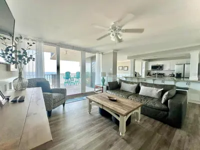 a living room with a couch and a table at Pelican Walk 501 in Panama City Beach