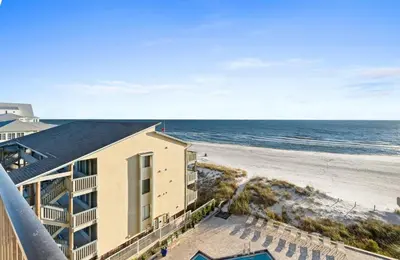 a view of the beach from the balcony of a condo at Pelican Walk 502 in Panama City Beach