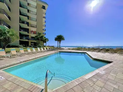 a swimming pool in front of a building at Pelican Walk 110 in Panama City Beach