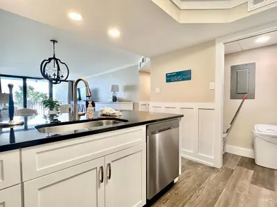 a kitchen with a sink and a toilet at Pelican Walk 302 in Panama City Beach