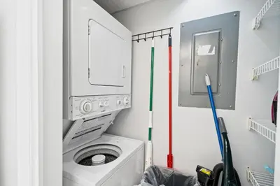 a laundry room with a washer and dryer at Pelican Walk 509 in Panama City Beach