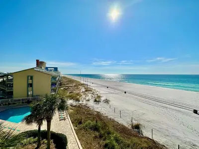 a view of a beach with a house and the ocean at Pelican Walk 405 in Panama City Beach
