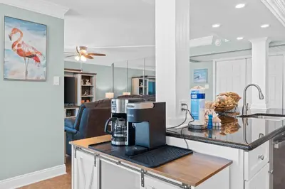 a kitchen with a counter with a coffee maker on it at Pelican Walk 812 in Panama City Beach