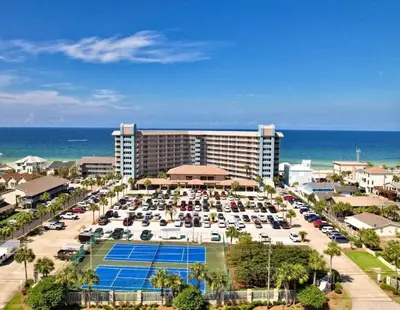 an aerial view of a hotel with a parking lot at Pelican Walk 812 in Panama City Beach