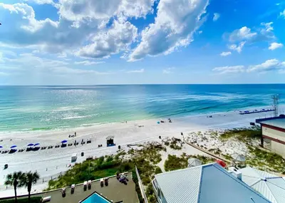 an overhead view of a beach with people and the ocean at Pelican Walk 912 in Panama City Beach