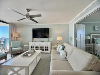 a living room with a couch and a table at Pelican Walk 912 in Panama City Beach