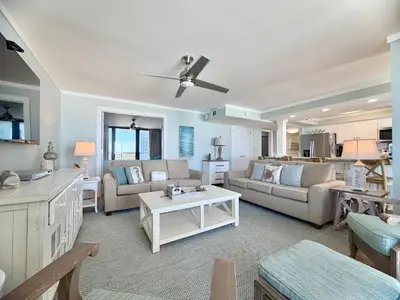a living room with a couch and a table at Pelican Walk 912 in Panama City Beach