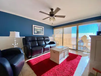 a living room with a couch and a table at Gulfgate 304 in Panama City Beach