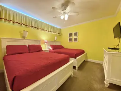 a bedroom with two beds and a ceiling fan at Gulfgate 304 in Panama City Beach