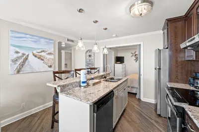 a kitchen with a sink and a counter top at Pelican Walk 104 in Panama City Beach