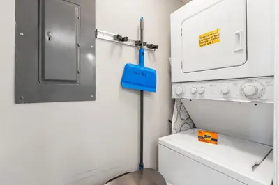 a small laundry room with a washer and dryer at Pelican Walk 703 in Panama City Beach