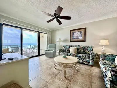 a living room with a couch and a table at Gulfgate 311 in Panama City Beach