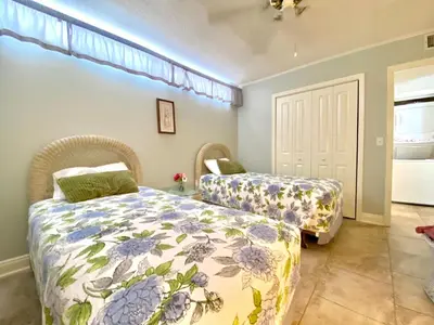 a bedroom with two beds and a window at Gulfgate 311 in Panama City Beach