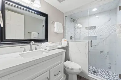 a bathroom with a sink and a toilet and a shower at Pelican Walk 111 in Panama City Beach