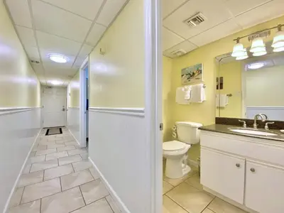 a bathroom with a toilet and a sink at Pelican Walk 802 in Panama City Beach