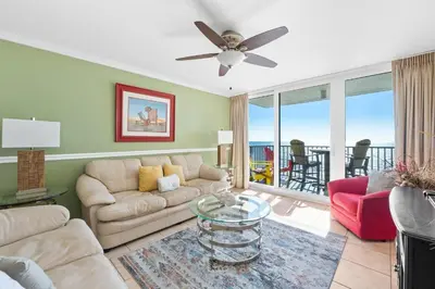a living room with a couch and a table at Pelican Walk 802 in Panama City Beach