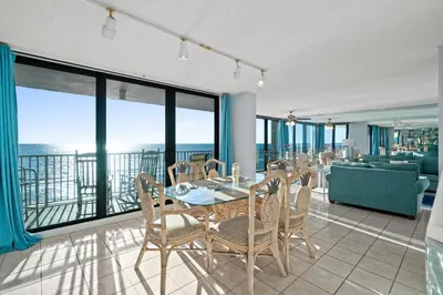 a dining room with a table and chairs at Pelican Walk 706 in Panama City Beach