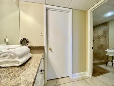 a bathroom with a shower and a sink at Pelican Walk 806 in Panama City Beach