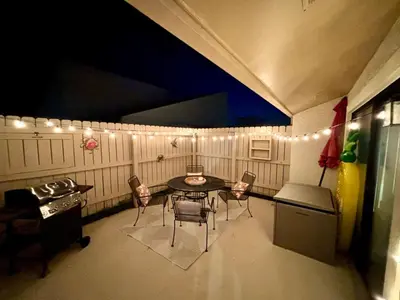a kitchen with a table and chairs in a room at Cozy Beach Condo in Complex in Panama City Beach