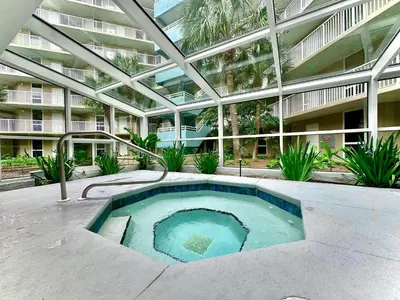 a swimming pool in the middle of a building at Pelican Walk 810 in Panama City Beach