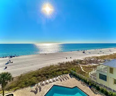 an aerial view of a beach and a building at Pelican Walk 810 in Panama City Beach