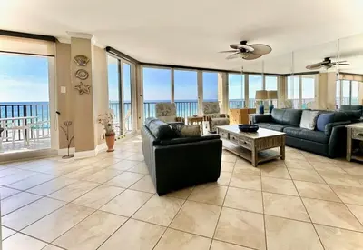 a living room with a view of the ocean at Pelican Walk 406 in Panama City Beach