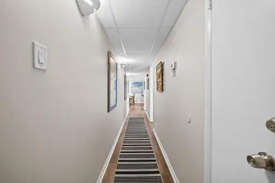 a hallway with black and white striped flooring at Pelican Walk 911 in Panama City Beach