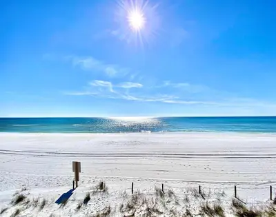 a sandy beach with the ocean in the background at Pelican Walk 911 in Panama City Beach