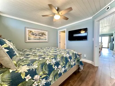 a bedroom with a bed and a ceiling fan at Gulfgate 102 in Panama City Beach