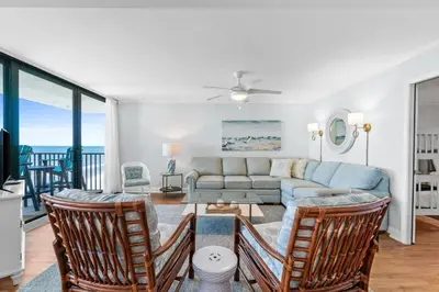 a living room with a couch and chairs at Pelican Walk 1008 in Panama City Beach