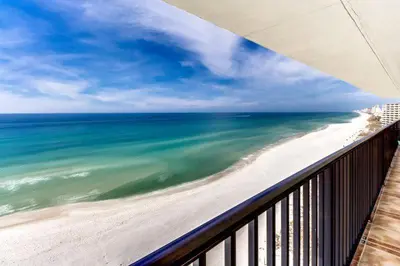 a view of the beach and ocean from a balcony at Pelican Walk 1006/1007 in Panama City Beach