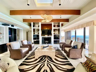 a living room with a couch and a table at Pelican Walk 1006/1007 in Panama City Beach