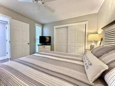 a bedroom with a bed and a tv in it at Gulfgate 205 in Panama City Beach