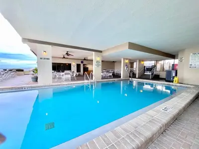 a large pool with blue water in a hotel at Gulfgate 205 in Panama City Beach