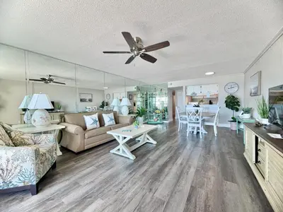 a living room with a couch and a ceiling fan at Gulfgate 205 in Panama City Beach