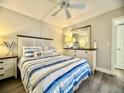 a bedroom with a bed and a ceiling fan at Gulfgate 205 in Panama City Beach