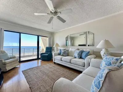 a living room with a couch and a ceiling fan at Gulfgate 301 in Panama City Beach